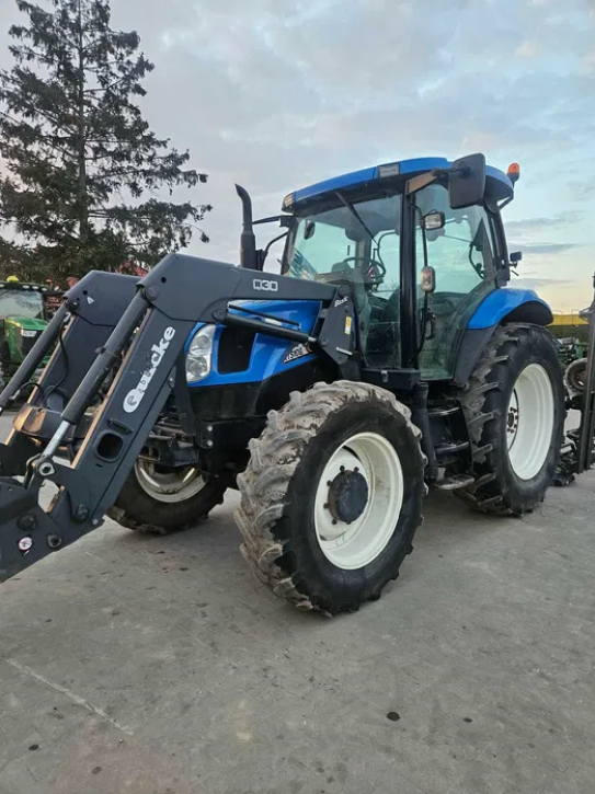 Ciągnik New Holland TS 100A z ładowaczem Quicke Q30 - Ciągnik - MAGJAR